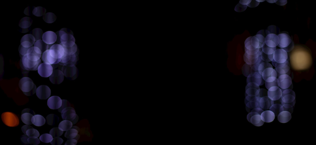 a blurry photo of lights in the dark