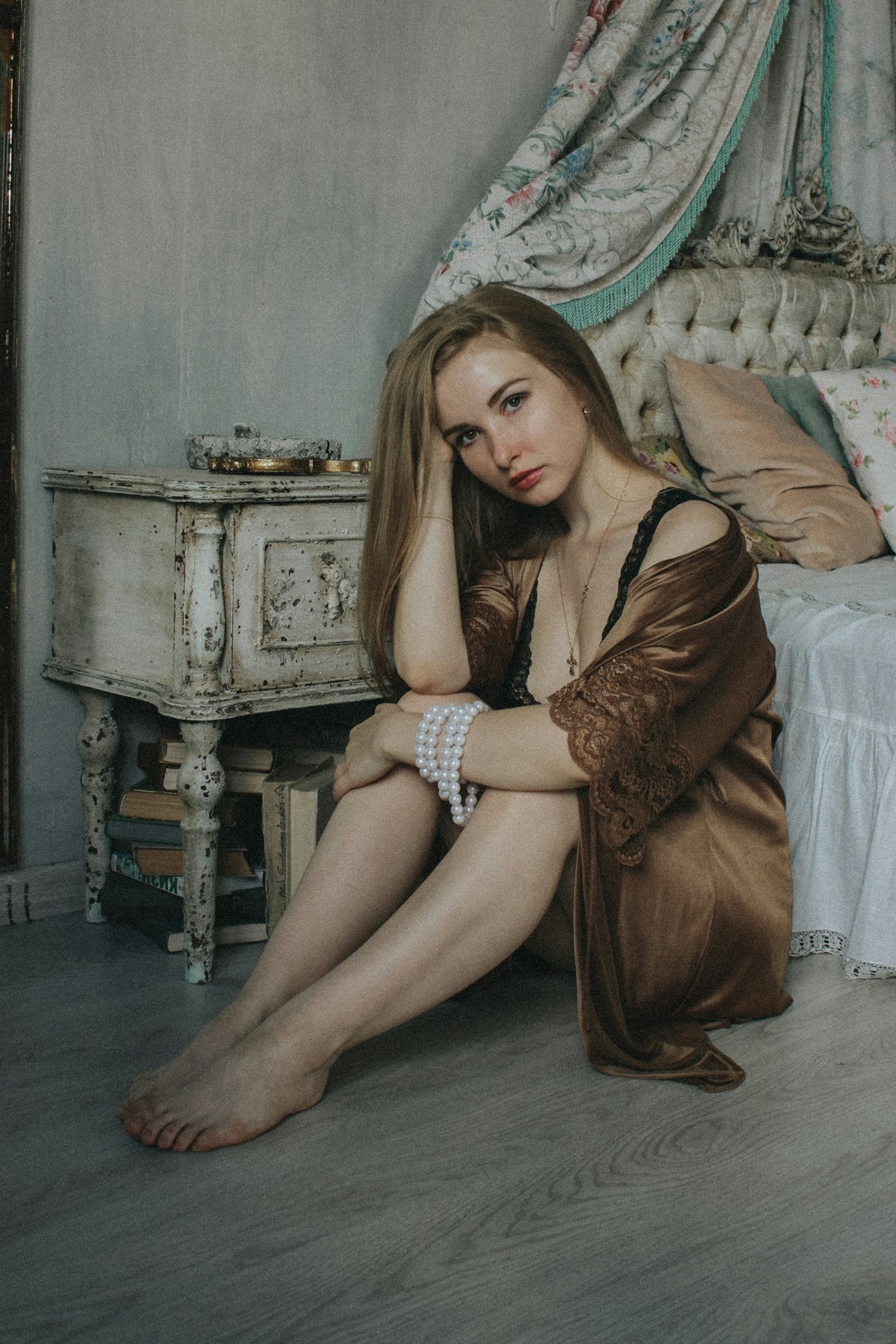 woman in brown long sleeve shirt sitting on couch