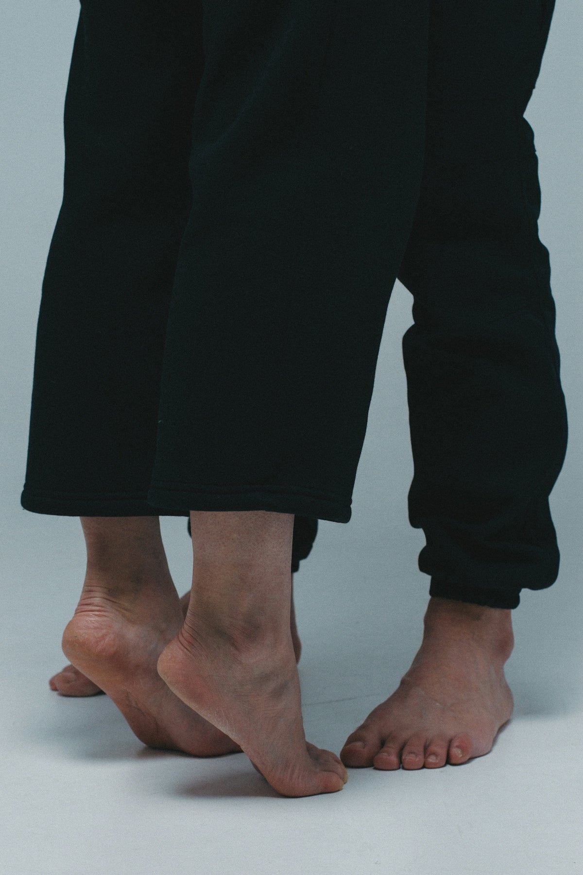 person in black pants standing