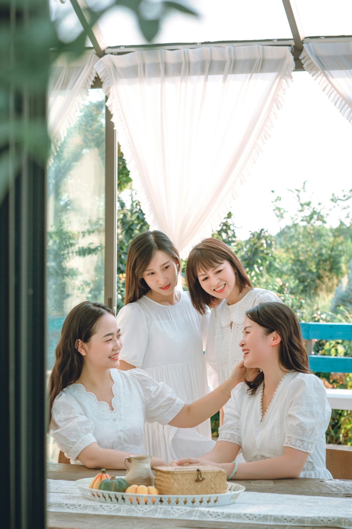 a group of women in white shirts