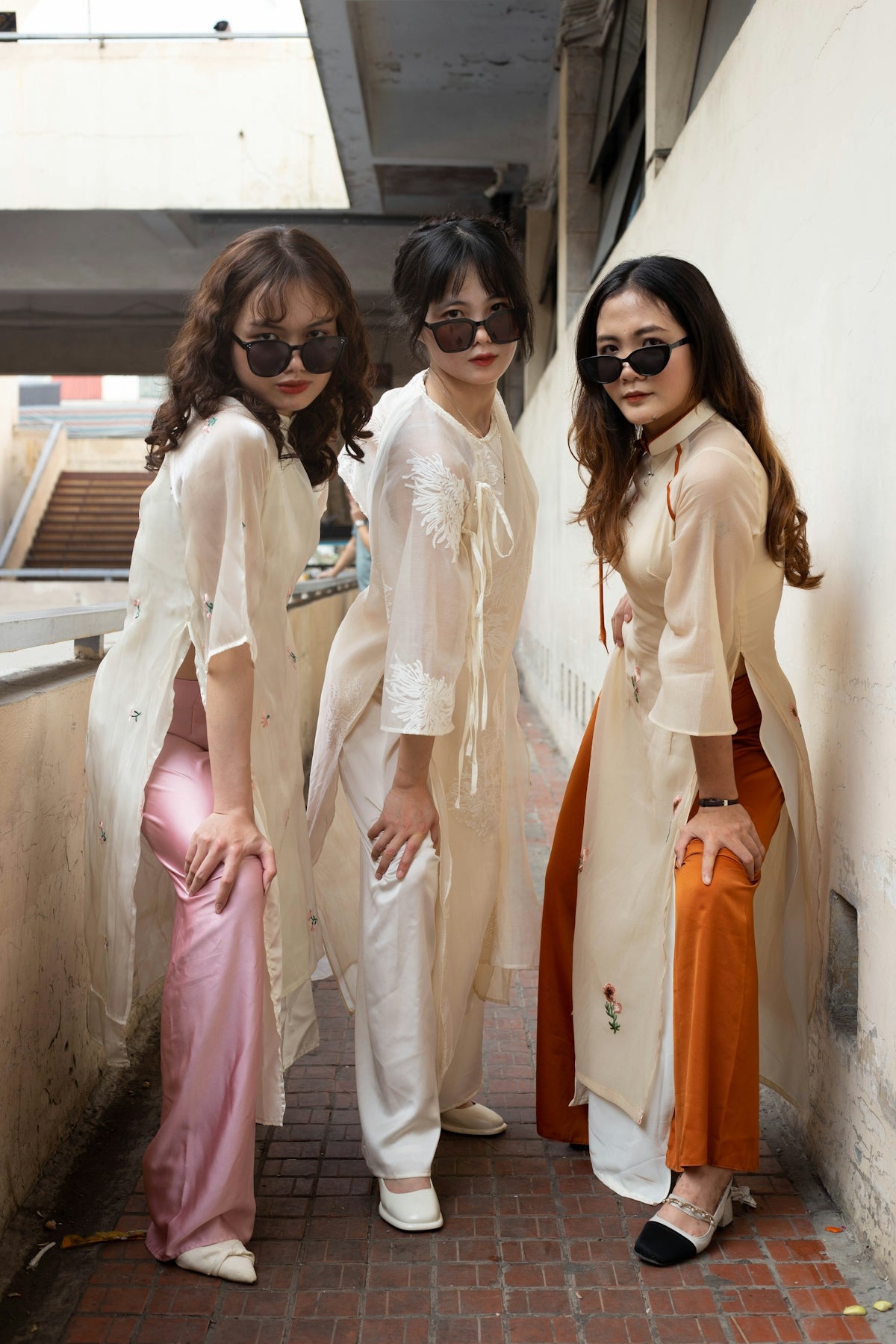 three young women standing next to each other
