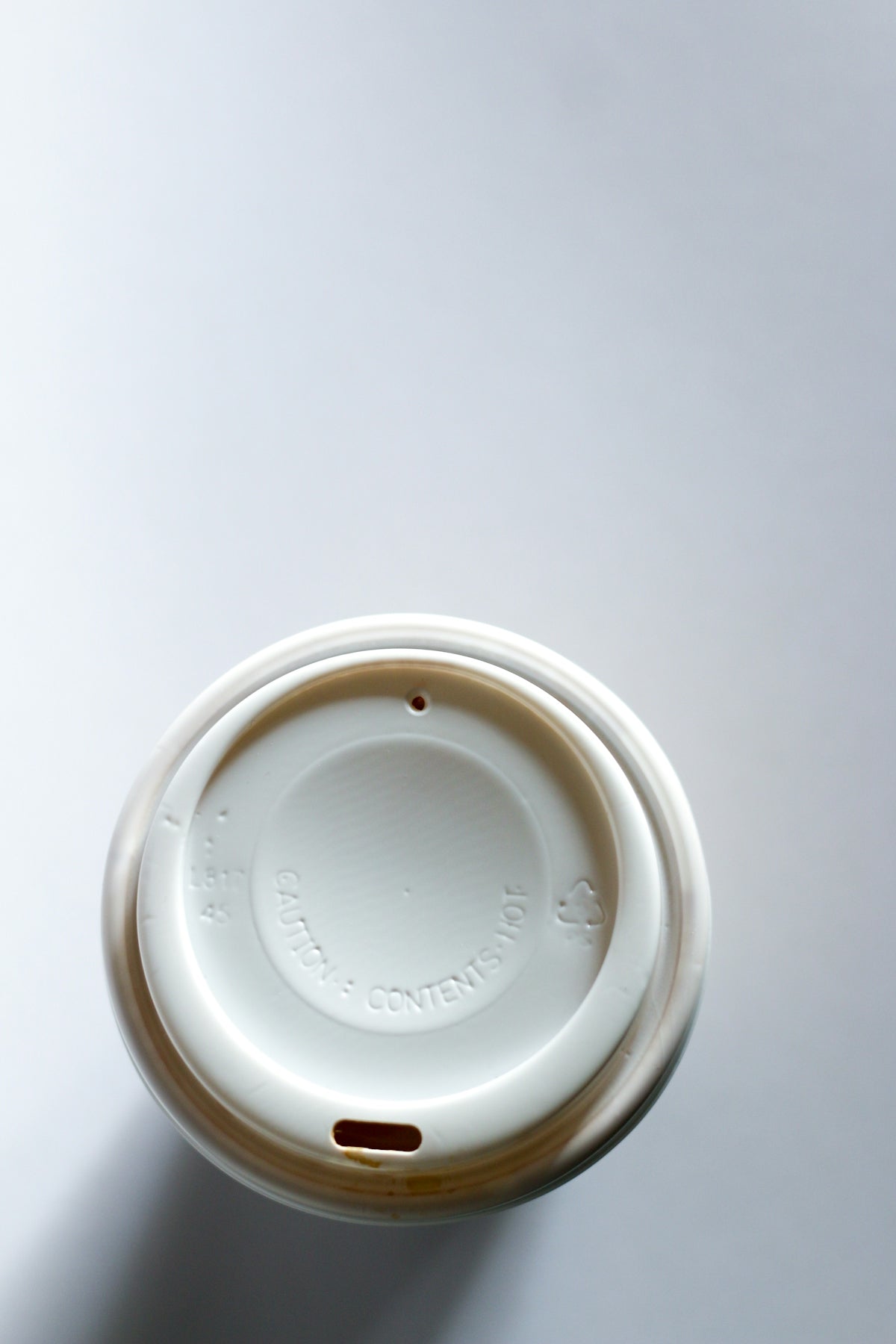 A coffee cup sitting on top of a table