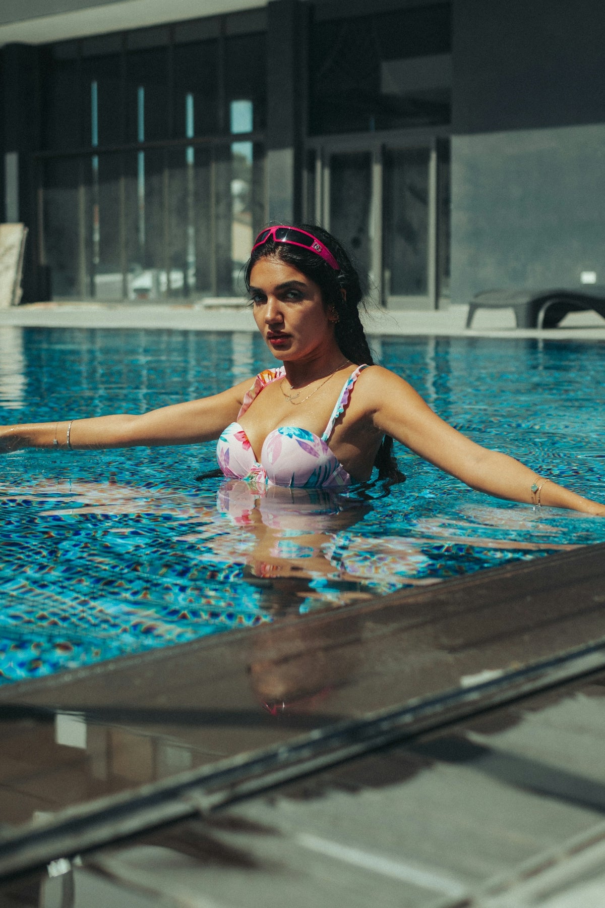 A woman in a bikini in a swimming pool