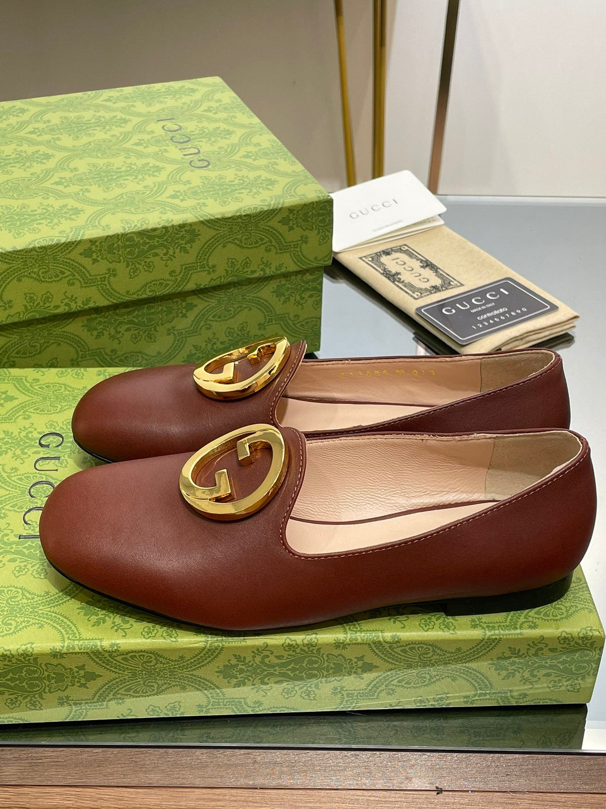 BLONDIE LOGO-PLAQUE LOAFERS IN SYRUP BROWN CALFSKIN