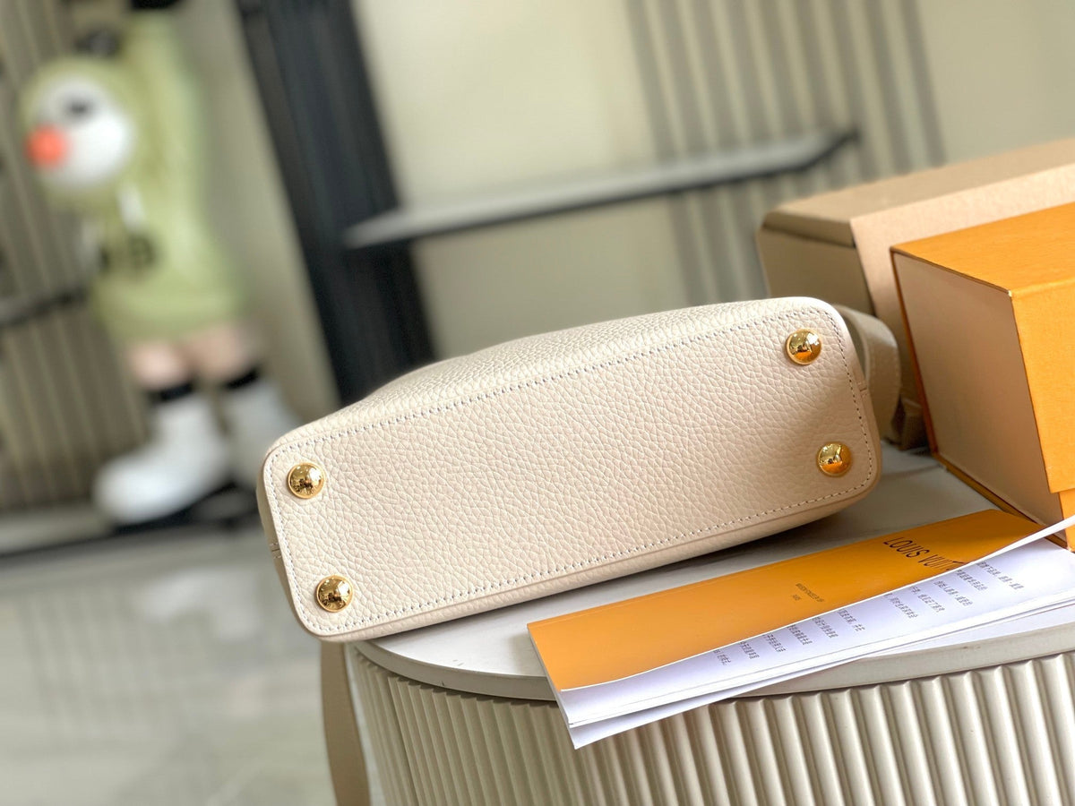 CAPUCINES MINI 21 BEIGE TAURILLON GOLD HARDWARE