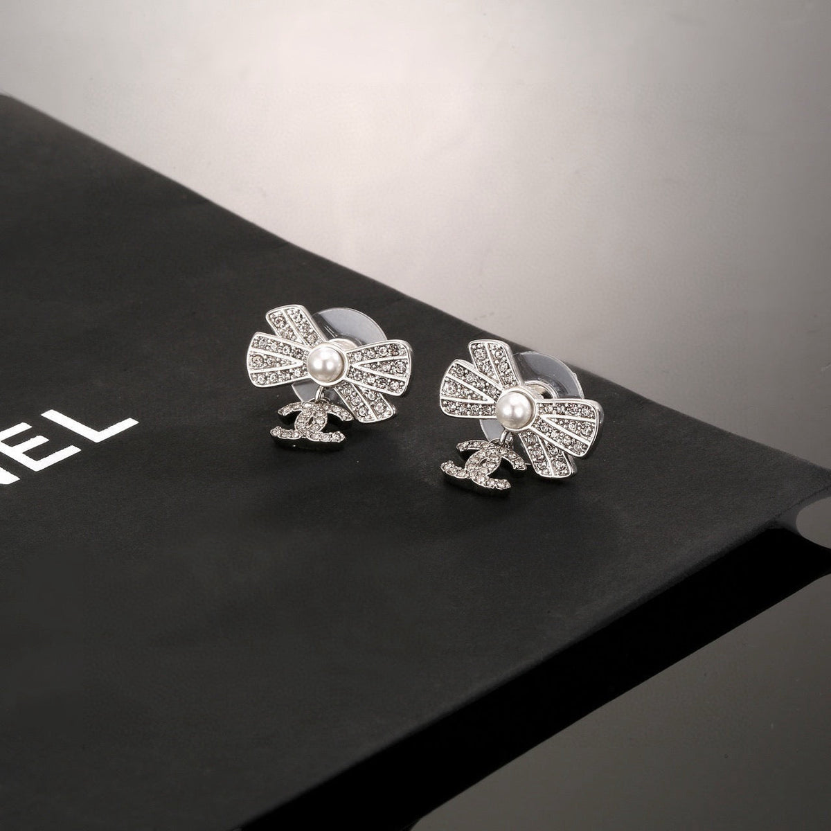 CC Double C Bow Sliver Diamond Pearl Earrings