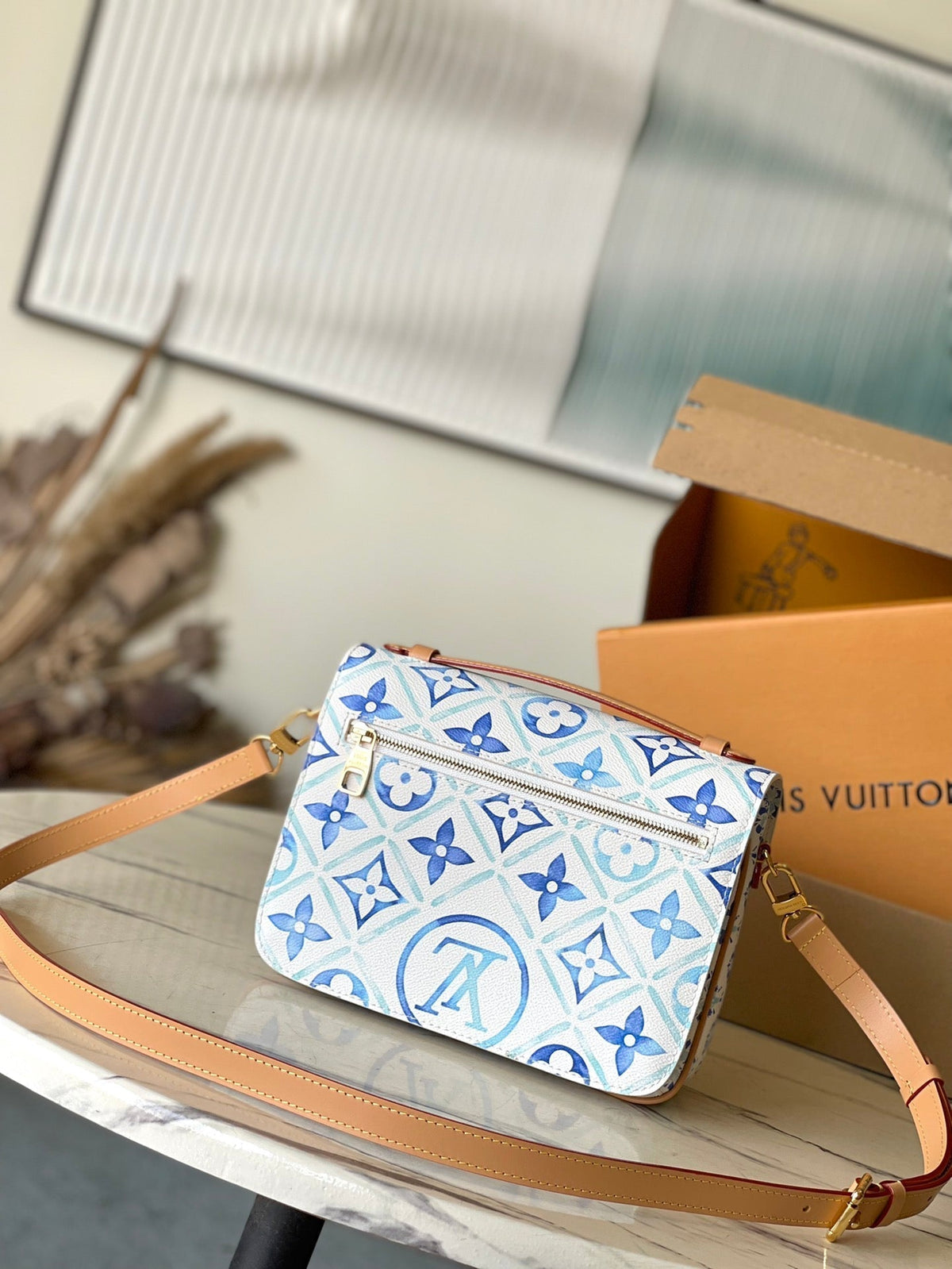 POCHETTE MÉTIS 25 IN LAGOON BLUE MONOGRAM TILES CANVAS GOLD HARDWARE