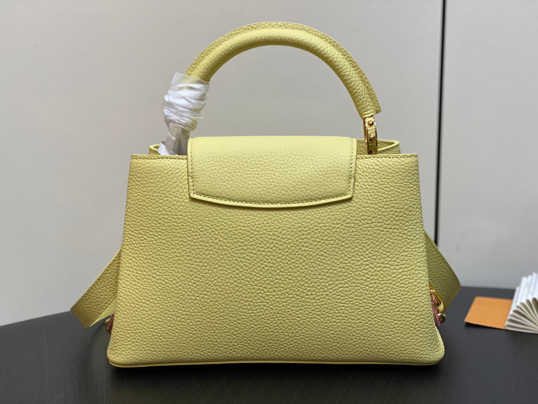 capucines mm 31.5 yellow taurillon leather gold hardware